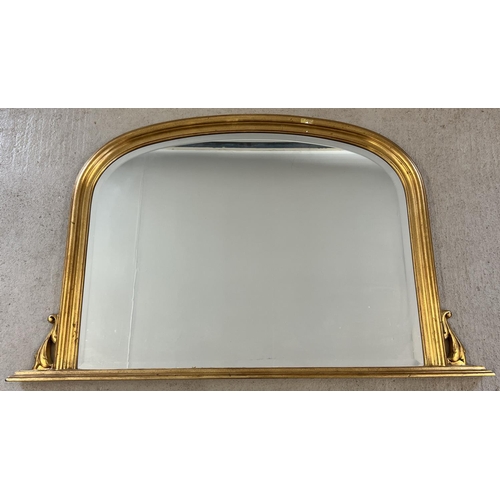 1320 - A large gilt frame wall hanging over mantle mirror with scroll detail to sides. Approx. 78 x 124cm.