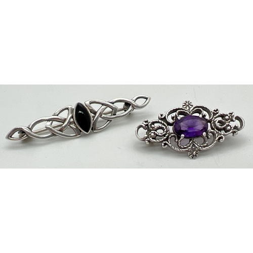 1036 - 2 decorative silver stone set brooches. A celtic design bar brooch set with marquise cut black onyx,... 