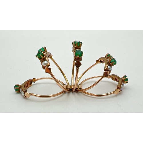 1053 - A vintage gold, emerald and seed pearl harem ring. Ring consists of 5 small bands each set with smal... 