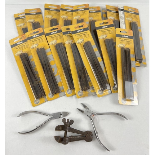 1294 - A collection of 18 packets of unopened Rolson 150mm junior hacksaw blades together with a small clam... 