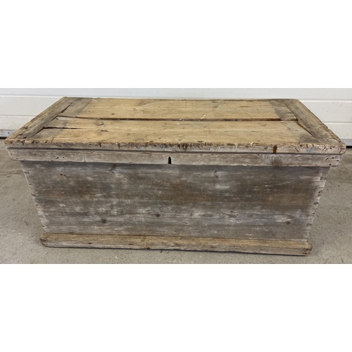 1323 - An antique 2 handled pine box with drop down handles and dove tail joints. Some damage to lid. Appro... 