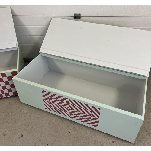 1325 - 2 large painted wooden storage/toy chests decorated with optical illusion patterns. Both with lift u... 