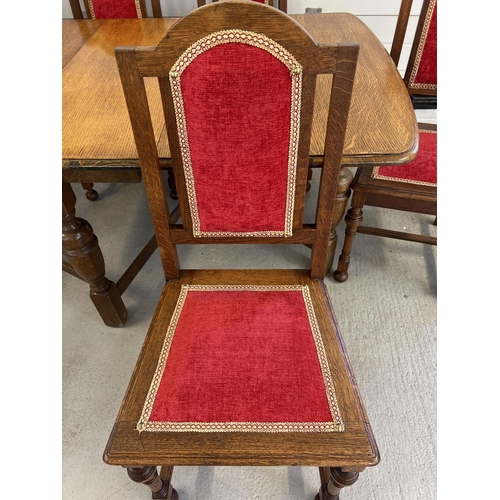 1328 - A vintage medium oak drop leaf table with shaped legs together with 6 dining chairs with red and gol... 