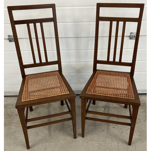 1329 - A pair of Arts & Crafts design bedroom chairs with inlaid detail, front tapered legs and re-caned se... 