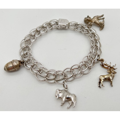 1064 - A vintage open circle link silver bracelet with clasp, safety clip and 4 vintage animal charms. Char... 