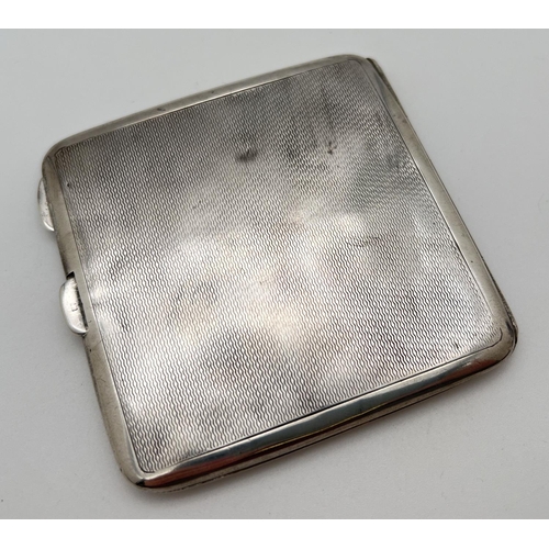 1124 - A vintage silver cigarette case with engine turned decoration to front and back. Square cartouche to... 