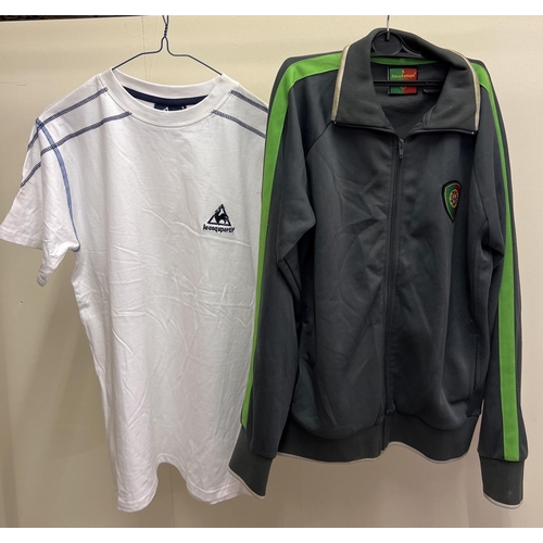 1221 - A Portugal FC zip up long sleeved sports top - size S, together with a Le Coq Sportif short sleeved ... 