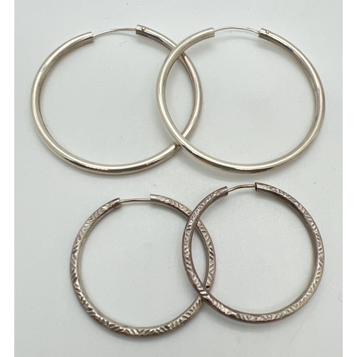 1036 - 2 pairs of 925 silver hooped earrings, both stamped on posts. A pair of 3.75cm diameter hoops with d... 