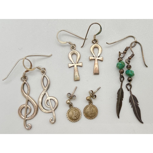 1038 - 4 pairs of silver and white metal drop earrings. To include 3.5cm drop treble clef earrings and 2.5c... 