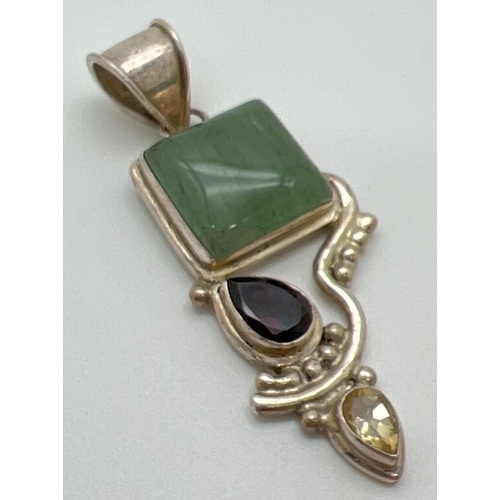 1010 - A large modern design pendant set with a square aventurine stone and teardrop cut lemon and coloured... 