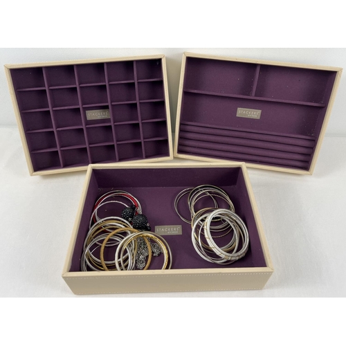 1052 - 3 'Stackers' jewellery trays, in faux leather with purple baize interior, with a small selection of ... 