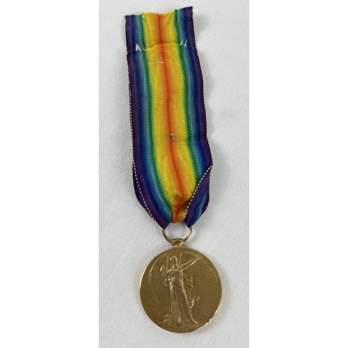 1148 - A WWI Victory medal with ribbon named to rim 