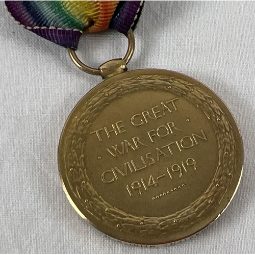 1148 - A WWI Victory medal with ribbon named to rim 