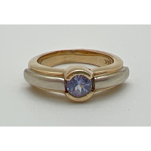 1005 - A modern design 14k gold tanzanite solitaire style dress ring by Le Vian. White and yellow gold deta... 