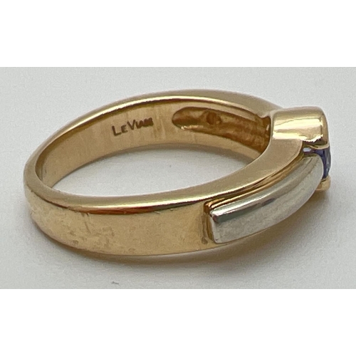 1005 - A modern design 14k gold tanzanite solitaire style dress ring by Le Vian. White and yellow gold deta... 