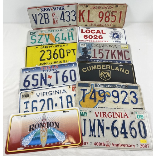 1254 - A collection of 12 assorted painted aluminium plates, mostly US automobile plates.