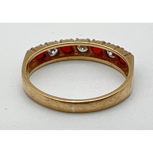 1055 - A vintage 9ct gold half eternity style ring set with alternating round cut garnets and cubic zirconi... 