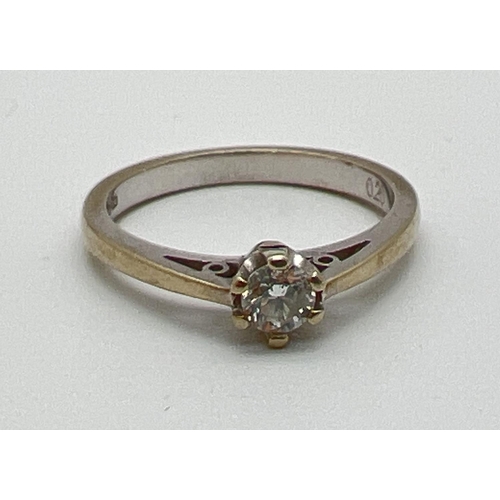 1056 - A 9ct white gold .20ct diamond solitaire ring. Full hallmarks to inside of band. Size K½, total weig... 