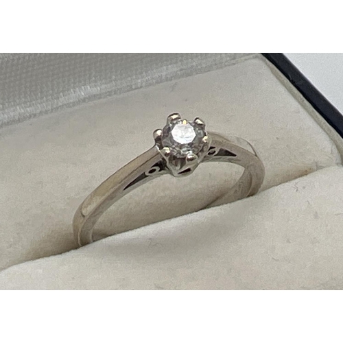 1056 - A 9ct white gold .20ct diamond solitaire ring. Full hallmarks to inside of band. Size K½, total weig... 