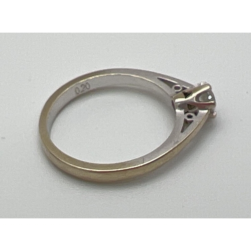 1056 - A 9ct white gold .20ct diamond solitaire ring. Full hallmarks to inside of band. Size K½, total weig... 