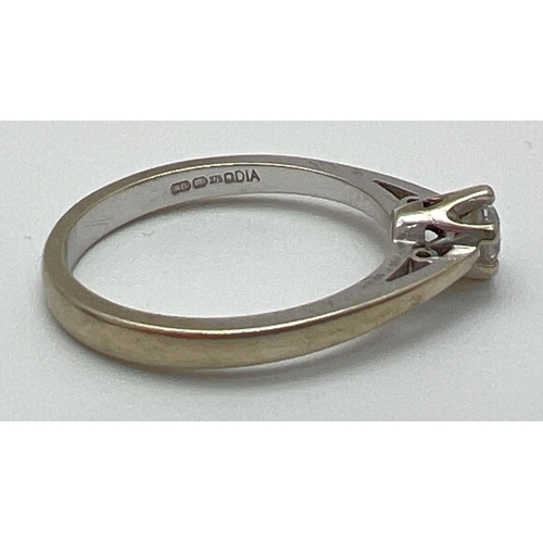 1056 - A 9ct white gold .20ct diamond solitaire ring. Full hallmarks to inside of band. Size K½, total weig... 