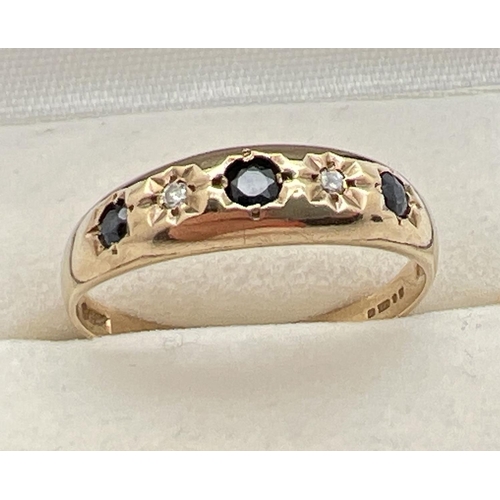 1061 - A vintage 9ct gold diamond and sapphire Gypsy style dress ring. Set with 3 blue sapphires and 2 diam... 