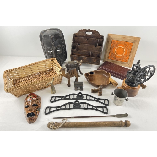 1256 - A box of assorted vintage wooden and metal items. To include: grinder, letter rack, carved animals a... 