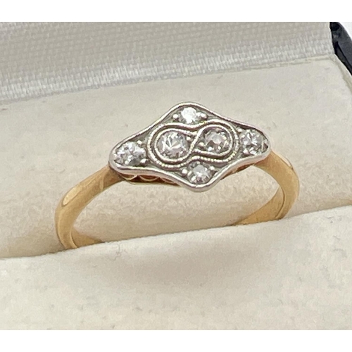 1001 - An 18ct gold Art Deco diamond dress ring. Diamond shaped mount with pierced work to sides, set with ... 