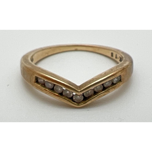 1066 - A 9ct gold wishbone dress ring with 9 channel set small round cut diamonds, total ct. 0.15. Full hal... 