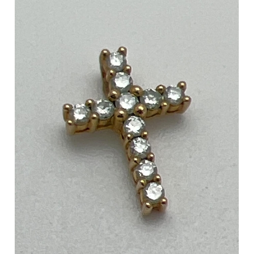 1068 - A small diamond set 9ct gold cross shaped pendant. Diamond total .25ct. Full hallmarks and diamond c... 