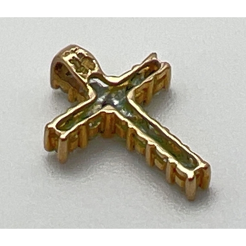 1068 - A small diamond set 9ct gold cross shaped pendant. Diamond total .25ct. Full hallmarks and diamond c... 