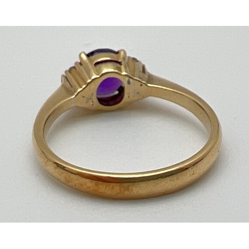 1069 - An 18ct gold amethyst and diamond dress ring. 
A central round cut .75ct amethyst with 3 small round... 