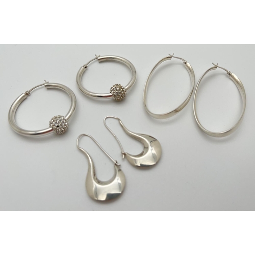 1076 - 3 pairs of silver hoop style earrings ti include oval twist design and hoops with crystal set remova... 