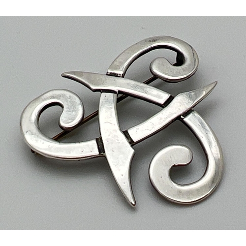 1080 - A silver Celtic knot brooch. Full hallmarks to back of brooch. Approx. 4cm x 4cm. Total weight appro... 