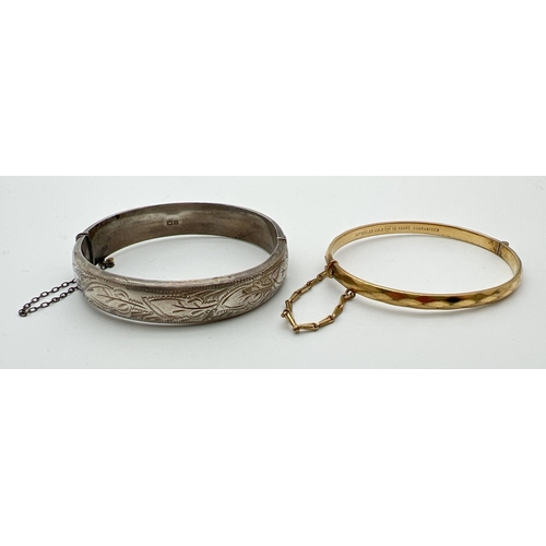 1086 - 2 vintage bangles. A silver bangle with safety chain, half engraved with floral detail, hallmarked B... 