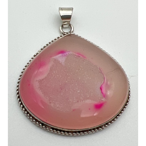 1088 - A large modern design pink druzy quartz pendant in a silver mount. Bale marked 925. Approx. 5.5 x 5c... 