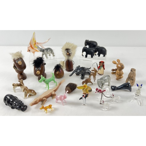 1260 - A collection of assorted vintage miniature animal figures to include glass, wood, ceramic, felt and ... 