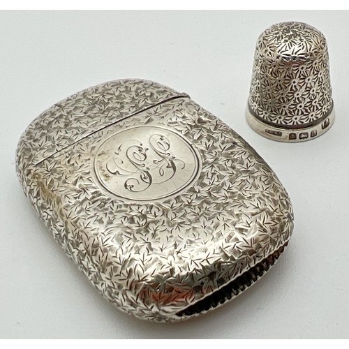 1130 - An antique silver Vesta case with floral decoration throughout and engraved initials to front cartou... 