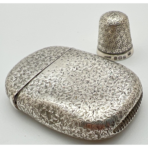 1130 - An antique silver Vesta case with floral decoration throughout and engraved initials to front cartou... 