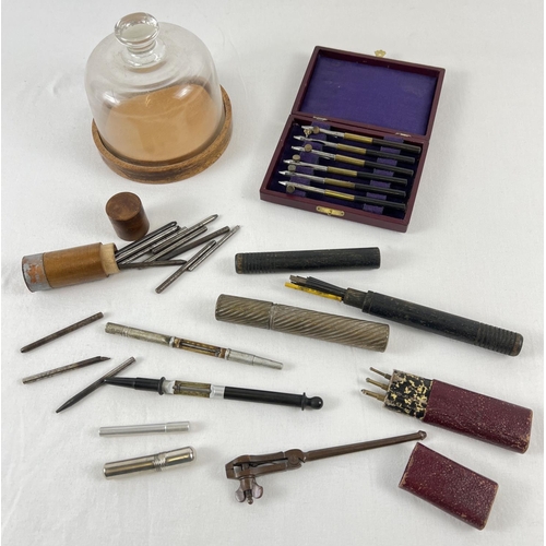 1116 - A collection of vintage watch makers tools. To include a glass domed topped parts container, blades,... 