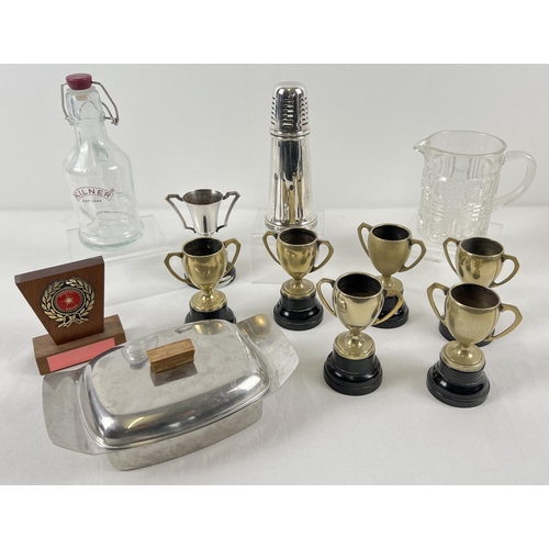 1270 - A box of assorted vintage items to include silver plated trophy cups, Viners sugar sifter, mid centu... 