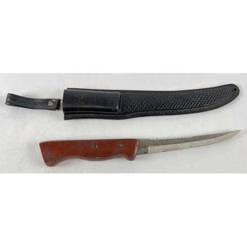 1155 - A wooden handled 5.5 inch blade survival knife with hard plastic sheath and carry loop.