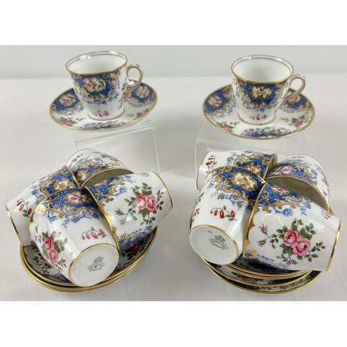 1178 - A set of 10 Aynsley coffee cups and saucers in a floral design, with blue and gilt detail.