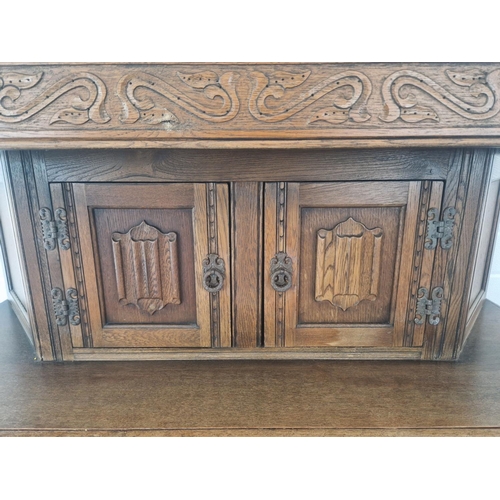 1291 - A vintage medium oak Old Charm court cupboard with Gothic style metal drop down handles & hinges. Tr... 