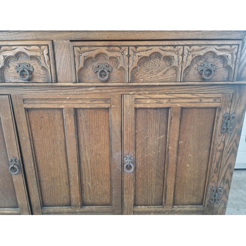 1291 - A vintage medium oak Old Charm court cupboard with Gothic style metal drop down handles & hinges. Tr... 