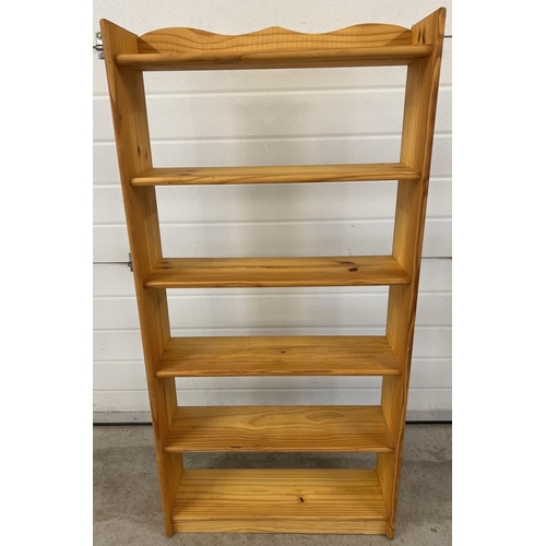 1299 - A modern pine open backed 6 shelf bookcase with shaped top. Approx. 124cm tall x 61cm wide.