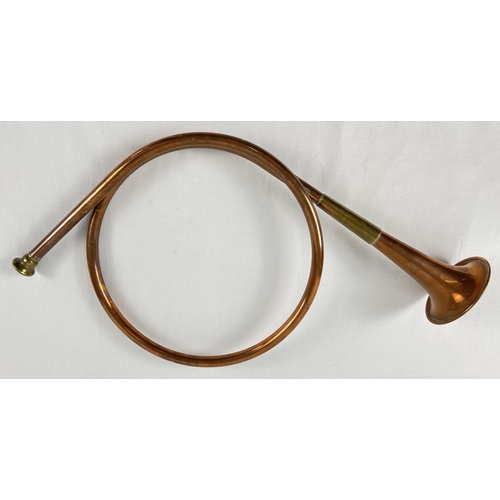 1140 - A vintage brass and copper circular hunting horn. Total length approx. 46cm.