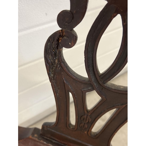 1304 - An Edwardian Chippendale style high back corner chair with carved detail. Decoratively shaped suppor... 