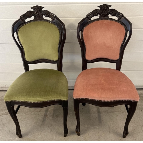 1306 - A pair of dark wood vintage chairs with carved detail to backs and studded upholstery. In green and ... 