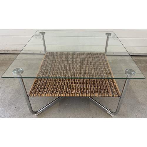 1308 - A large modern metal framed coffee table with glass top and basket weave undershelf. Approx. 46cm ta... 